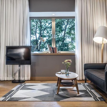 The Guesthouse Wien Eksteriør bilde A living room in a serviced apartment in Warsaw, Poland